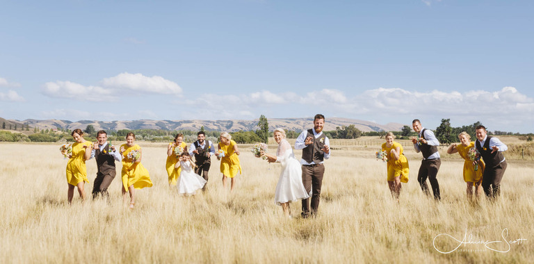 Image of bridal party in the Martinborough fields taken by Alicia Scott - Wairarapa wedding photographer