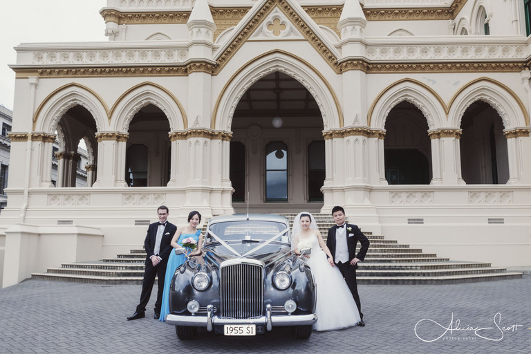 Photo of wedding party outside the old Parliamentary Library taken by Alicia Scott, Wellington wedding photographer