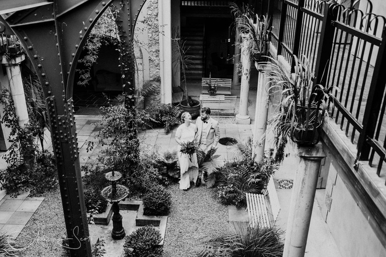 Black and white image of a wedding couple taken inside the Milk Station on the Kapiti Coast by Alicia Scott Photographer